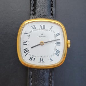 Vintage Catorex mekaniska romerska siffror unisex schweizisk tillverkad guldpläterad klocka
