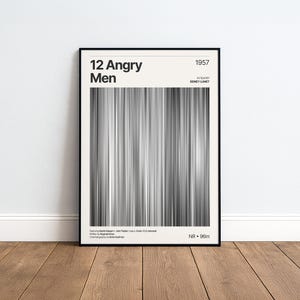 Könnte beinhalten: Ein gerahmtes Filmplakat für den Film 12 Angry Men aus dem Jahr 1957 unter der Regie von Sidney Lumet. Das Design zeigt eine vertikale, graustufige Grafik im Barcode-Stil, mit schwarzem Text auf cremefarbenem Hintergrund, der den Titel nennt.