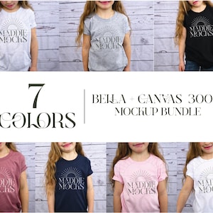 Op de afbeelding: Mockup-bundel met zeven Bella + Canvas 3001Y T-shirts in verschillende kleuren. De shirts hebben een grafisch ontwerp met de tekst "Maddie Mocks" en een zon-afbeelding.
