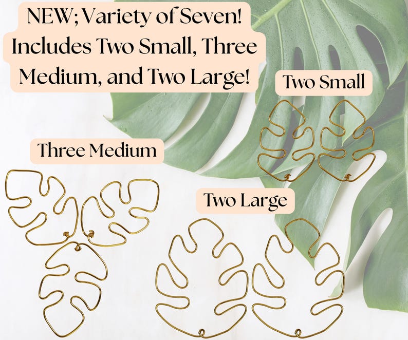 May include: A set of seven gold-toned wire leaf shapes in three distinct sizes. The collection includes two small, three medium, and two large wire outlines. Text on the image reads: NEW; Variety of Seven! Includes Two Small, Three Medium, and Two Large!