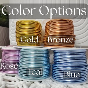 May include: Spools of wire in gold, bronze, rose, teal, and blue colors.  Color Options.