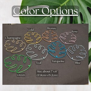 Puede incluir: Variedad de formas de hojas de alambre en colores como oro, bronce, rosa, champ&aacute;n, verde, turquesa, azul y verde azulado. El texto "Color Options" est&aacute; en la parte superior. Tama&ntilde;o aproximado de 17,8 cm x 15,2 cm.