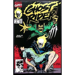 May include: A comic book cover for Ghost Rider #7. The cover features a flaming skull, a green monster, and a woman in a blue dress. The title "Ghost Rider" is in yellow, with the Marvel Comics logo in the upper left corner. The text "Trail of Blood" is also visible.