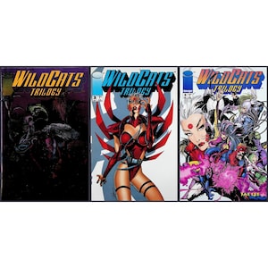 May include: Three WildC.A.T.S. Trilogy comic books are displayed. The covers feature vibrant illustrations of characters in action, with bold text and dynamic artwork. The comics showcase a variety of colors and styles.