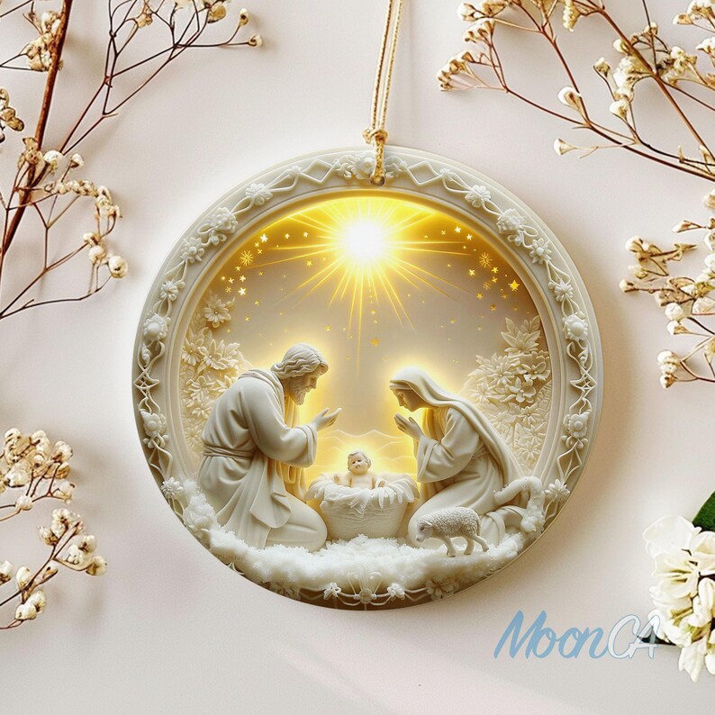 May include: A white, circular Christmas ornament depicting the Nativity scene. The ornament features Joseph, Mary, and baby Jesus, with a lamb and a bright light in the background. The ornament has a gold string for hanging.