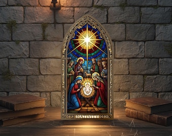 May include: A stained glass nativity scene featuring a starburst design. The artwork shows Mary, Joseph, and baby Jesus, with the word "NATIVITY" at the base. It's set against a brick wall with a torch, evoking a traditional feel.