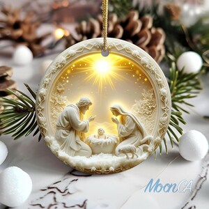 May include: A round, off-white Christmas ornament with a religious scene. The ornament features a relief of Mary, Joseph, and baby Jesus, with a bright light emanating from behind. A gold string is attached for hanging.