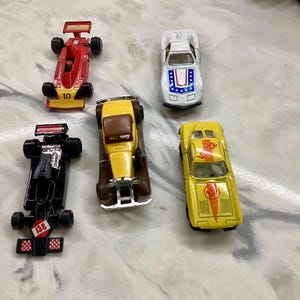 Lot of 5 unbranded die cast cars. Good vintage condition!