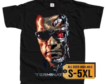 May include: Black t-shirt with a graphic of Arnold Schwarzenegger's face morphing into the Terminator robot. The text "TERMINATOR" is at the bottom of the image. The text "ALL SIZES AVAILABLE S-5XL" is in a yellow box.