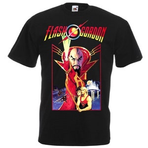 May include: Black t-shirt with a graphic print of the movie "Flash Gordon". The graphic features Ming the Merciless, Flash Gordon, and Dale Arden.