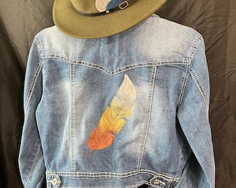 Custom hand-painted upcycled jean jacket with gold and silver feather, women's small