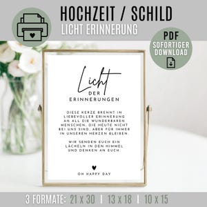 Pode incluir: Uma impressão emoldurada com o texto "HOCHZEIT / SCHILD LICHT ERINNERUNG" e "Licht der Erinnerungen". A impressão inclui um símbolo de coração e as palavras "OH HAPPY DAY". Disponível em 3 tamanhos: 21 x 30 cm, 13 x 18 cm e 10 x 15 cm.