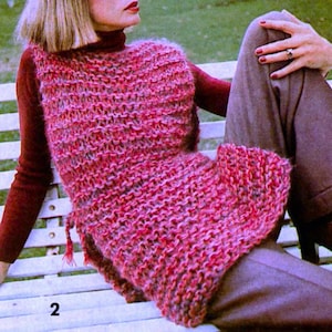 May include: A pink and purple knitted sleeveless top with a tie at the side. The top is made with a chunky yarn and has a loose fit.