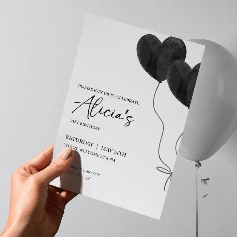 May include: A white birthday invitation card featuring two black heart-shaped balloons with strings. The text reads: PLEASE JOIN US TO CELEBRATE Alicia's 21ST BIRTHDAY SATURDAY | MAY 14TH YOU'RE WELCOME AT 8 PM STREET 123, ANY CITY 001-234 567.