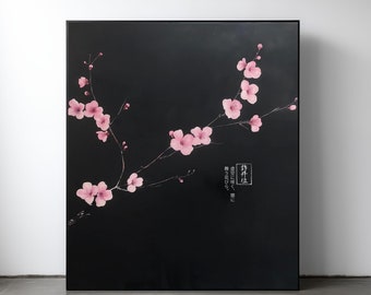 May include: A black canvas painting featuring a single branch of pink cherry blossoms against a black background. The Japanese text on the painting reads "桜に咲く、春に", which translates to "Blooming in the cherry blossoms, in spring".