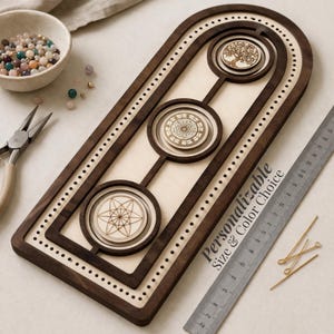 May include: A wooden craft organizer with three circular designs: a tree, a mandala, and a geometric star. The organizer is brown with a light wood interior and a series of small holes around the edges. Text reads "Personalizable Size & Color Choice."