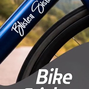 May include: Image of a black and blue bicycle with the text "Bike Stickers" and "Gift for Cyclists". The bike frame has the text "Blisten Sisters" and "Keep pedaling no excuses!"