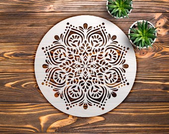 May include: A circular white wall art piece featuring a symmetrical, intricate laser-cut mandala pattern with delicate floral and geometric motifs. The design consists of openwork cutouts that create a detailed, repeating radial arrangement.