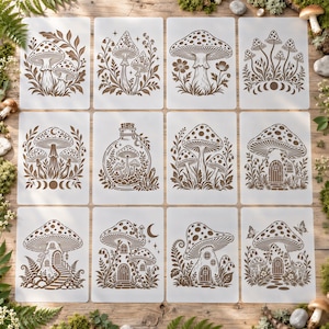 May include: A set of twelve rectangular stencils featuring brown illustrations of various mushrooms, forest scenes, and botanical elements. Each stencil displays distinct designs including mushrooms in jars, mushroom houses, and lunar phases.