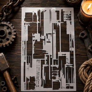 May include: A rectangular stencil featuring a complex, abstract pattern of vertical and horizontal lines, rectangular cutouts, and drip-like details. The stencil is semi-transparent and white, designed for creating intricate, layered textures.