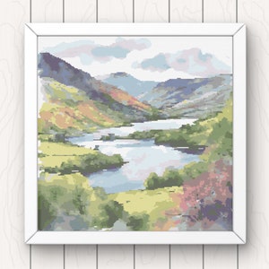 May include: A cross-stitch pattern depicting a scenic landscape with a winding river flowing through a valley surrounded by lush green hills and a cloudy sky.