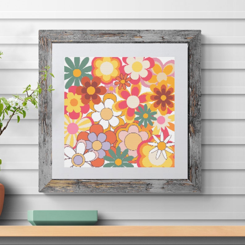 May include: A framed print featuring a retro-style floral design with a variety of colorful flowers in shades of orange, yellow, pink, red, and green.
