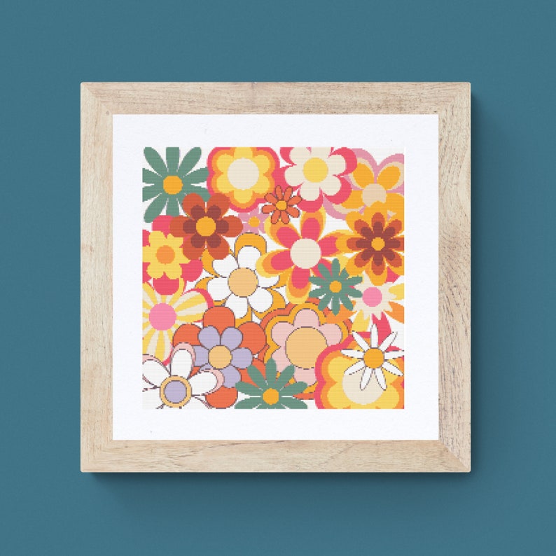 May include: A framed print featuring a retro-style floral pattern with a variety of colorful flowers in shades of orange, yellow, pink, red, and green.