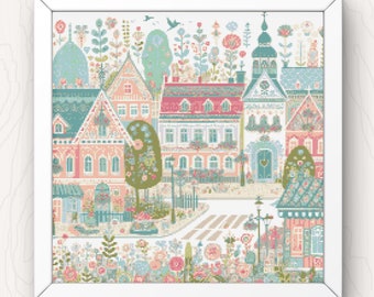 May include: A colorful cross-stitch pattern of a quaint town with houses, trees, and flowers. The houses are pink, blue, and green with white trim. The trees are green with pink flowers. The flowers are pink, blue, and yellow. The town is surrounded by a white frame.