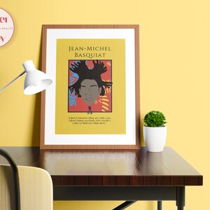 May include: A framed poster with a yellow background featuring a portrait of Jean-Michel Basquiat. The portrait is surrounded by colorful abstract shapes. The quote "I don't listen to what art critics say. I don't know anybody who knows a critic to find out what art is." is printed below the portrait.