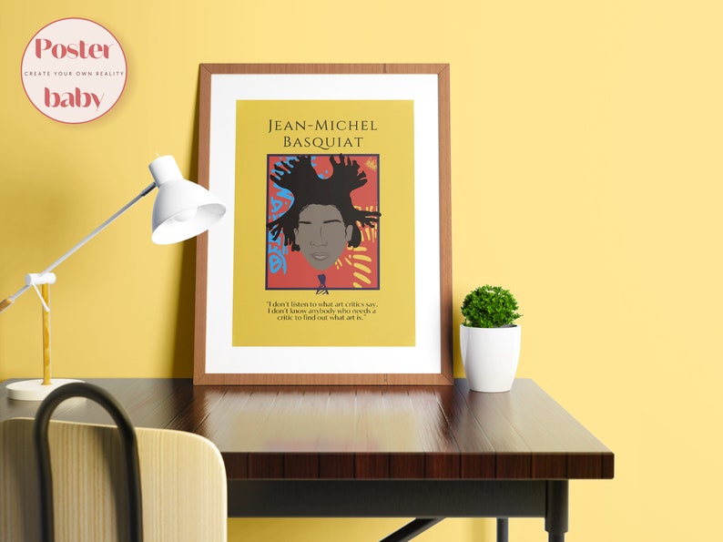 May include: A framed poster with a yellow background featuring a portrait of Jean-Michel Basquiat. The portrait is surrounded by colorful abstract shapes. The quote "I don't listen to what art critics say. I don't know anybody who knows a critic to find out what art is." is printed below the portrait.