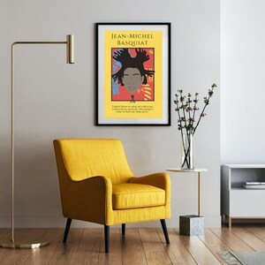 May include: A framed poster with a colorful illustration of Jean-Michel Basquiat, a famous artist. The poster has a black frame and a white background with the text "JEAN-MICHEL BASQUIAT" at the top. The quote "I don't listen to what art critics say. I don't know anybody who really knows a critic to find out what art is." is printed below the illustration.