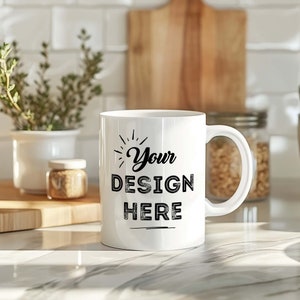 Puede incluir: Taza de cerámica blanca con un diseño negro que dice "Your Design Here" en una fuente de estilo vintage.