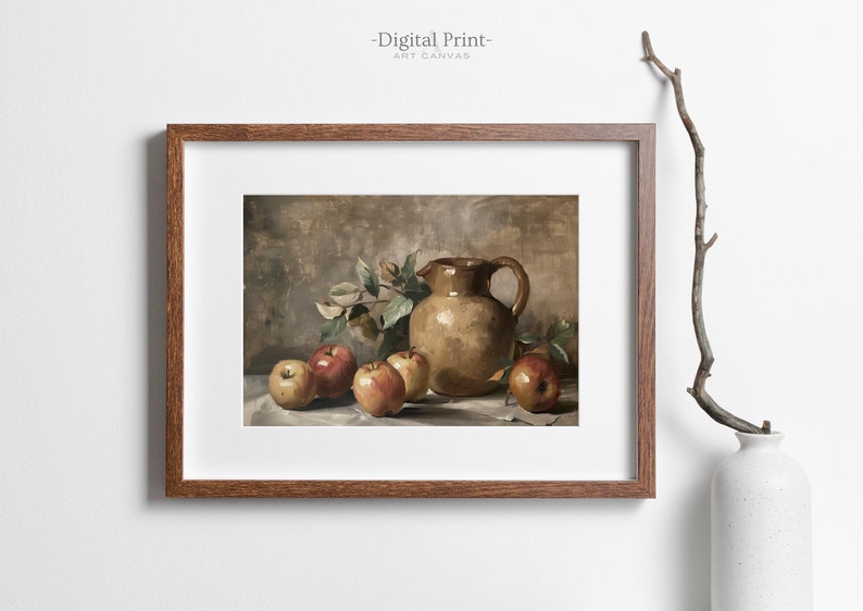May include: A framed digital print of a still life painting featuring a brown ceramic pitcher and red apples on a white tablecloth. The background is a muted brown color.