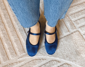 ample project . rich blue satin mary janes . purely handmade