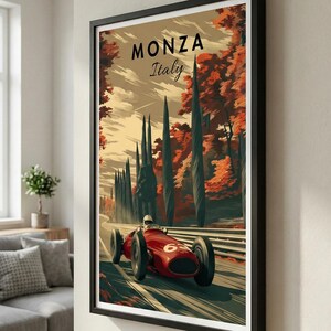 May include: Framed Monza Italy art print. A vintage race car speeds along a track lined with tall trees. The artwork features a red race car with the number 6, set against a backdrop of autumn foliage and the text "MONZA Italy".