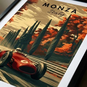 May include: Framed vintage-style poster featuring a red race car speeding on a track. The poster has the text "MONZA Italy" at the top, with a backdrop of trees in autumn colors. The race car has the number 63 on its side.