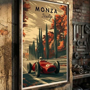 May include: Framed vintage poster of a red race car speeding on a track in Monza, Italy. The poster features the text "MONZA Italy" at the top, with a scenic backdrop of trees and a cloudy sky. The poster is displayed on a textured wall.