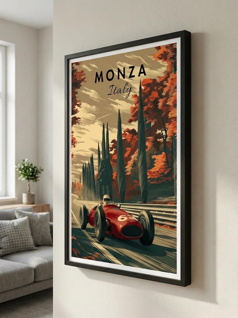 May include: Framed Monza Italy art print. A vintage race car speeds along a track lined with tall trees. The artwork features a red race car with the number 6, set against a backdrop of autumn foliage and the text "MONZA Italy".