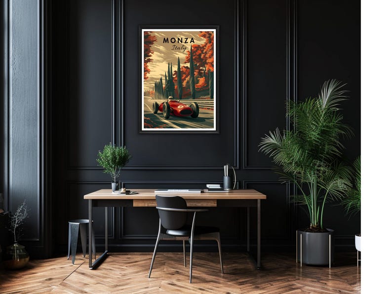 May include: A framed art print featuring a vintage race car speeding along a track in Monza, Italy. The artwork showcases a red race car against a backdrop of trees and the text "Monza Italy". The print is displayed on a black wall.