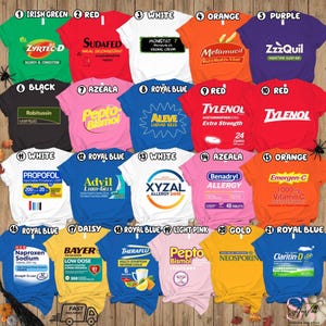 May include: A collection of t-shirts in various colors, each featuring a different brand name and product information. The shirts display labels for medications such as Zyrtec-D, Sudafed, Monistat 7, Metamucil, ZzzQuil, Robitussin, Pepto-Bismol, Aleve, Tylenol, Advil, XYZAL, Benadryl, Emergen-C, Naproxen, Bayer, Theraflu, and Neosporin.