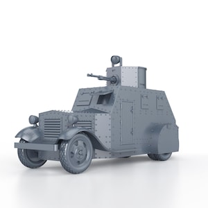May include: A gray armored car model with a machine gun turret on top. The car has a rounded front and a rectangular body with a door on the side. The model is detailed with rivets and other features.