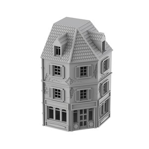 Puede incluir: Un edificio de esquina gris de tres pisos con un techo inclinado y varias ventanas. El edificio tiene un escaparate en la planta baja.