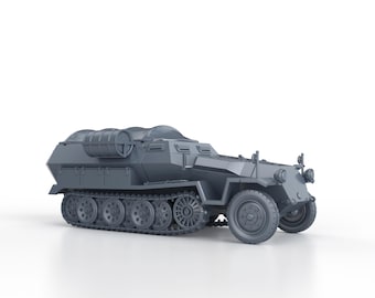 May include: A gray military vehicle with a canvas top and a large, cylindrical object on the back. The vehicle has a track system and a large front wheel.