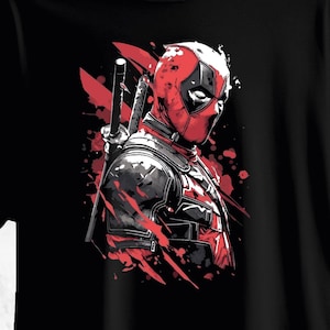 Pode incluir: Camiseta preta com uma ilustração estilizada de Deadpool. O design mostra Deadpool em seu traje vermelho e preto, com uma katana e respingos vermelhos. A obra de arte tem um estilo de história em quadrinhos.