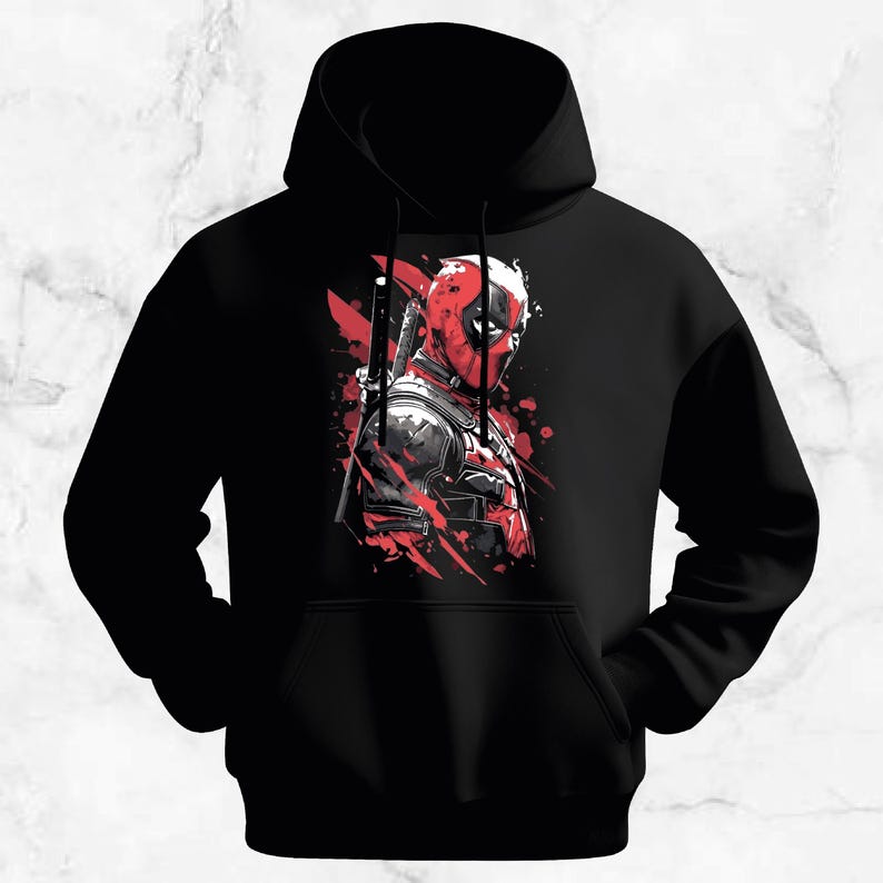 Peut inclure: Sweat &agrave; capuche noir avec un graphisme rouge et noir d'un personnage masqu&eacute; avec une &eacute;p&eacute;e. Le design a un effet aquarelle, avec des &eacute;claboussures de peinture rouge ajoutant au look dynamique. Le sweat &agrave; capuche a une poche avant et une capuche &agrave; cordon.
