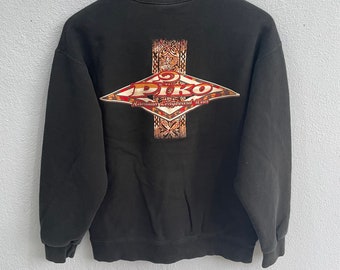 May include: Black sweatshirt with a large graphic print on the back. The graphic features a red and gold diamond shape with the text "PIKO Hawaiian Longboard Wear" inside.