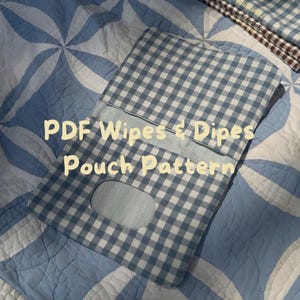 May include: A rectangular fabric pouch featuring a blue and white gingham check pattern with a centered oval cutout. The text PDF Wipes & Dipes Pouch Pattern is overlaid in light yellow. The pouch has a flap closure and stitched edges.