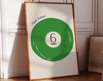 May include: A framed print with a green circle containing the number "6" and the text "Good Fortune".