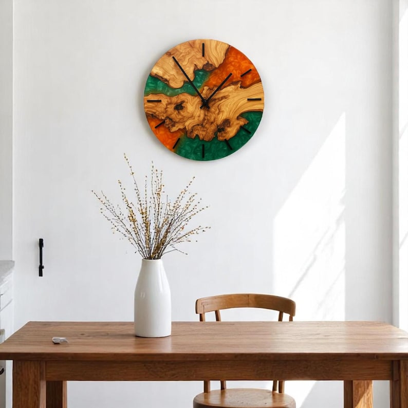 Modern rustic style olive wood wall clock with green and orange resin.