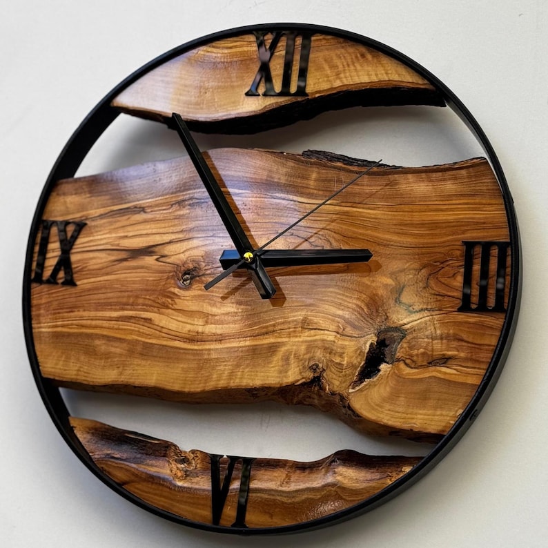 Rustic olive wood clock showing natural cracks and organic edge structure.